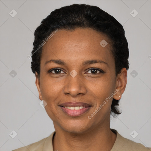 Joyful black young-adult female with short  black hair and brown eyes