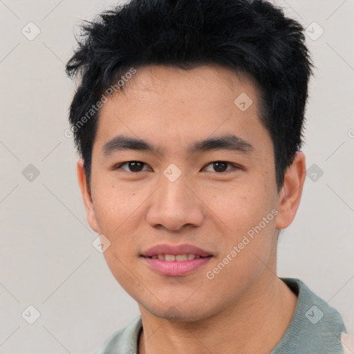 Joyful asian young-adult male with short  black hair and brown eyes