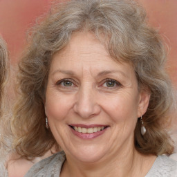 Joyful white middle-aged female with medium  brown hair and brown eyes