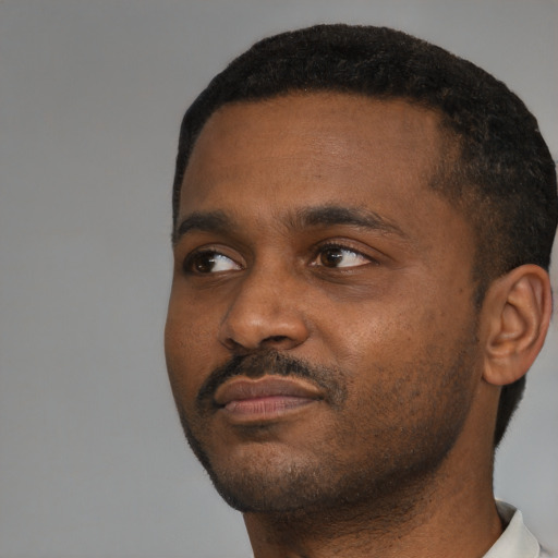 Neutral black young-adult male with short  black hair and brown eyes