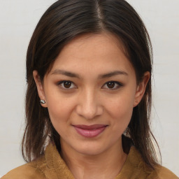 Joyful latino young-adult female with medium  brown hair and brown eyes