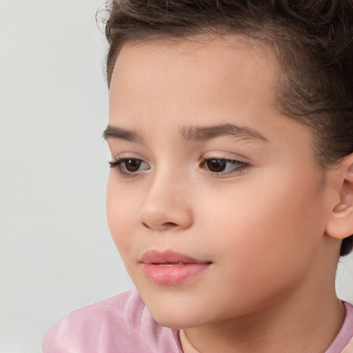 Joyful white child female with short  brown hair and brown eyes