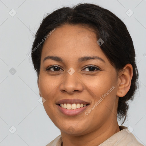 Joyful latino young-adult female with medium  brown hair and brown eyes