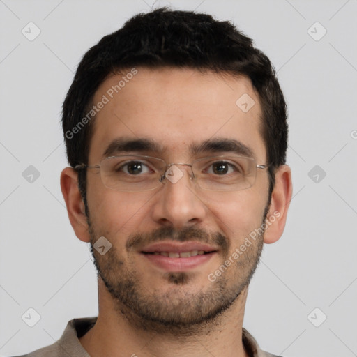 Joyful white young-adult male with short  brown hair and brown eyes