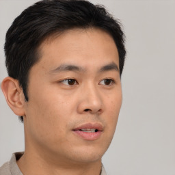 Neutral asian young-adult male with short  brown hair and brown eyes