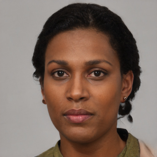 Neutral black young-adult female with medium  black hair and brown eyes