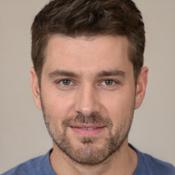 Joyful white adult male with short  brown hair and brown eyes