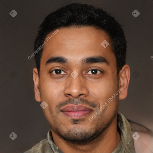 Joyful latino young-adult male with short  black hair and brown eyes