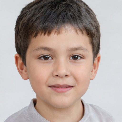 Joyful white child male with short  brown hair and brown eyes