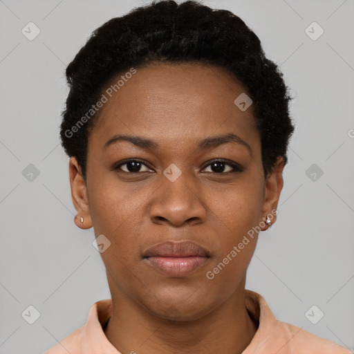 Joyful black young-adult female with short  black hair and brown eyes