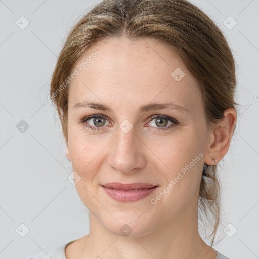 Joyful white young-adult female with medium  brown hair and green eyes