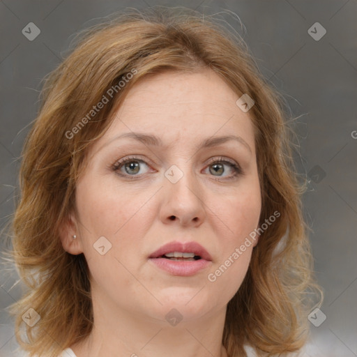 Joyful white adult female with medium  brown hair and green eyes