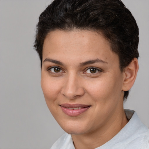 Joyful white young-adult female with short  brown hair and brown eyes