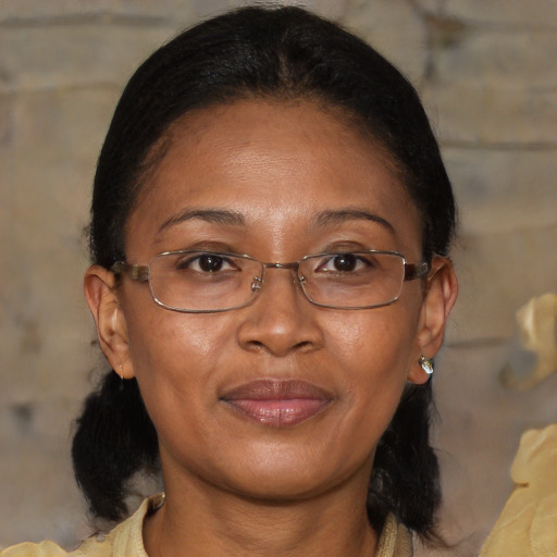 Joyful asian adult female with medium  brown hair and brown eyes