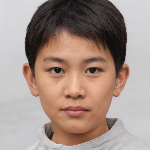 Neutral asian child male with short  brown hair and brown eyes