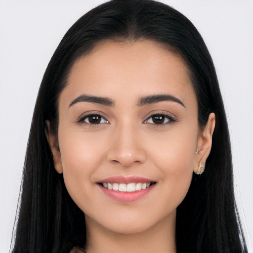 Joyful white young-adult female with long  black hair and brown eyes