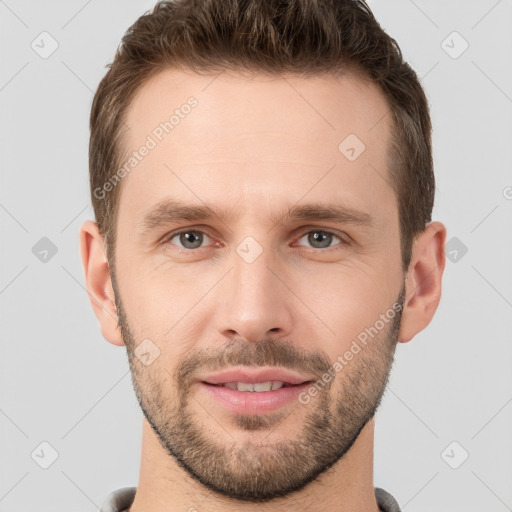 Joyful white young-adult male with short  brown hair and brown eyes