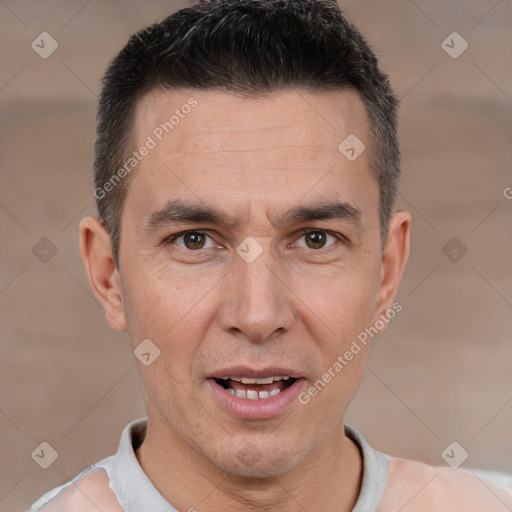 Joyful white adult male with short  brown hair and brown eyes