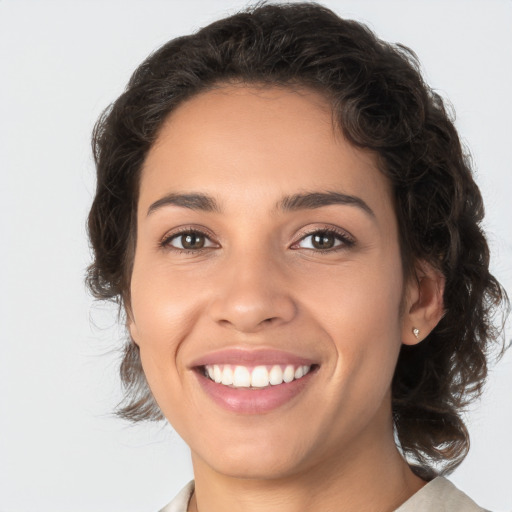 Joyful white young-adult female with medium  brown hair and brown eyes