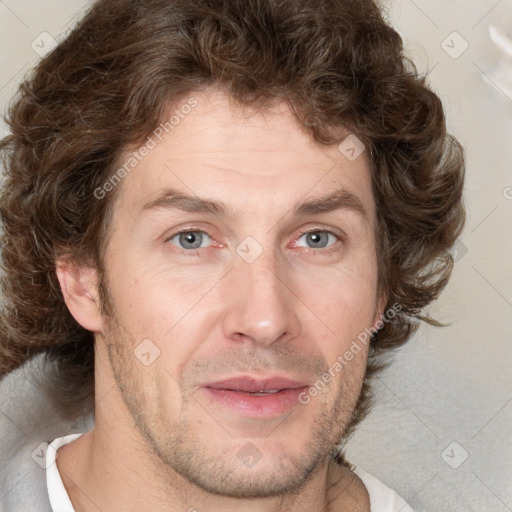 Joyful white adult male with short  brown hair and grey eyes