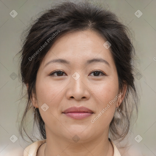 Joyful asian adult female with medium  brown hair and brown eyes