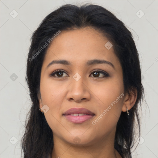 Joyful latino young-adult female with long  brown hair and brown eyes