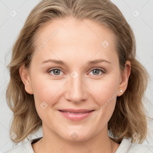 Joyful white young-adult female with medium  brown hair and blue eyes