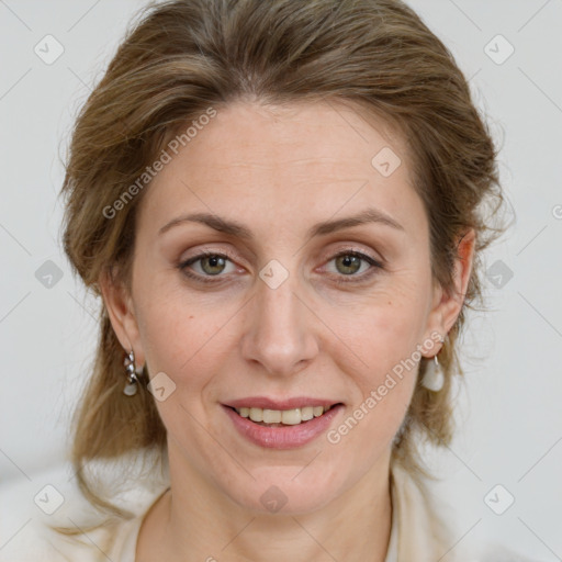 Joyful white adult female with medium  brown hair and green eyes