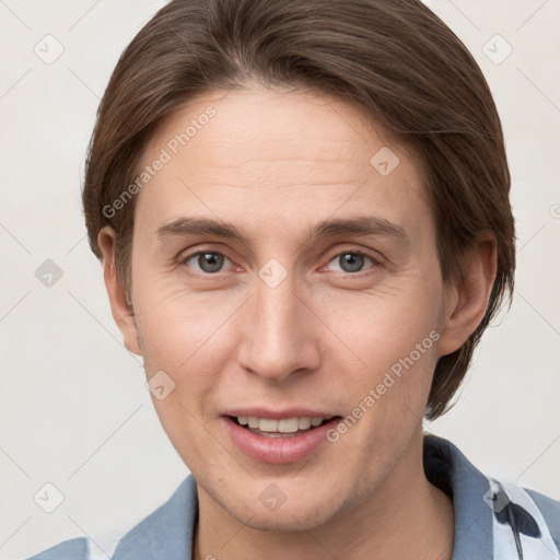 Joyful white young-adult female with short  brown hair and grey eyes