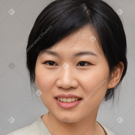 Joyful asian young-adult female with medium  black hair and brown eyes