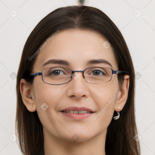 Joyful white young-adult female with long  brown hair and grey eyes