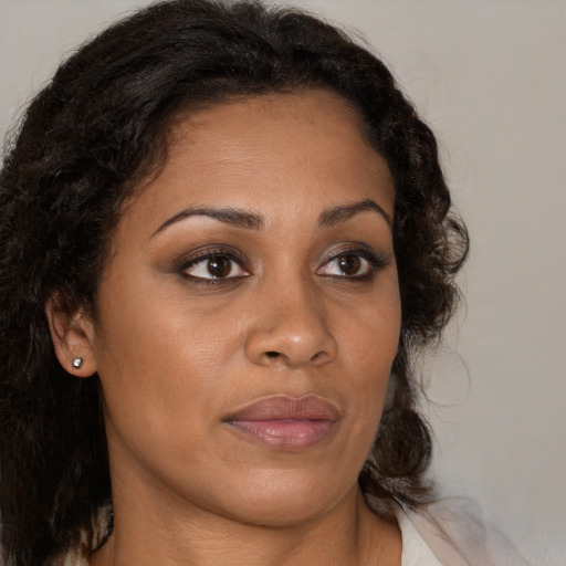 Joyful black young-adult female with medium  brown hair and brown eyes
