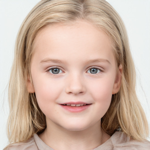 Joyful white child female with medium  brown hair and blue eyes