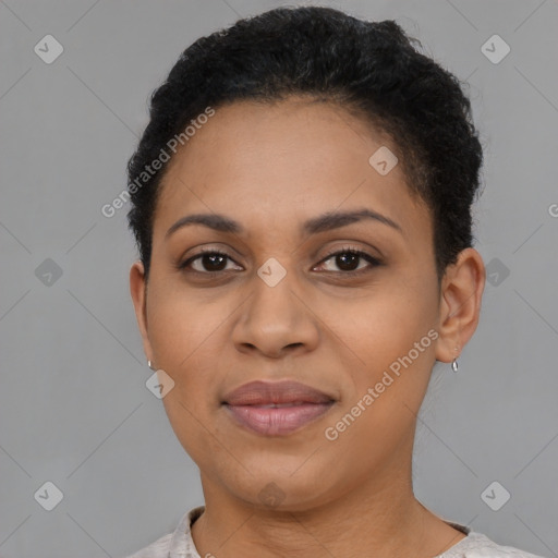 Joyful black young-adult female with short  brown hair and brown eyes