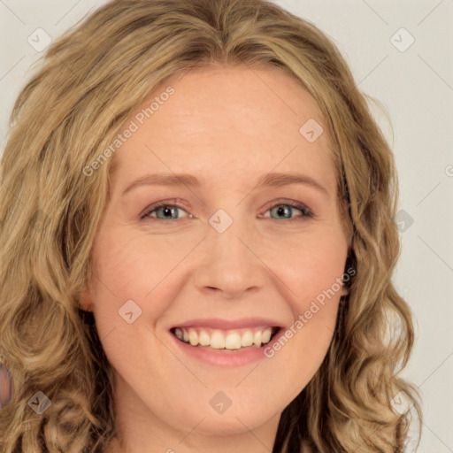 Joyful white young-adult female with long  brown hair and green eyes