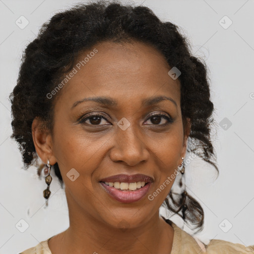 Joyful black adult female with medium  brown hair and brown eyes