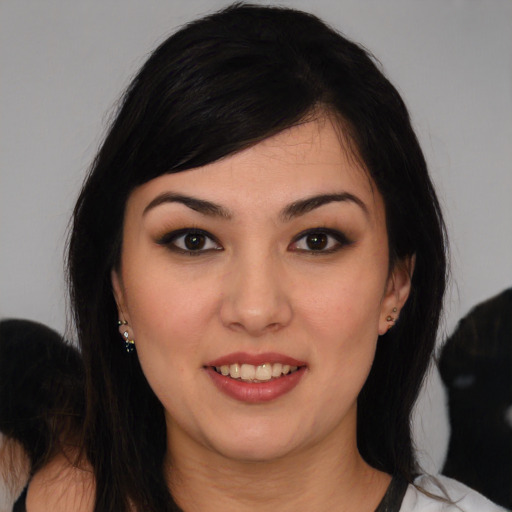 Joyful white young-adult female with medium  black hair and brown eyes