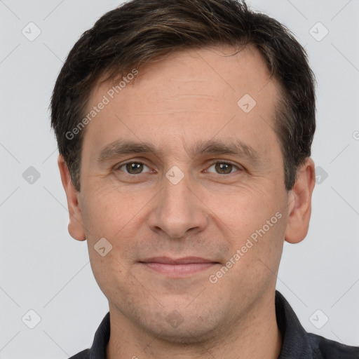 Joyful white adult male with short  brown hair and brown eyes