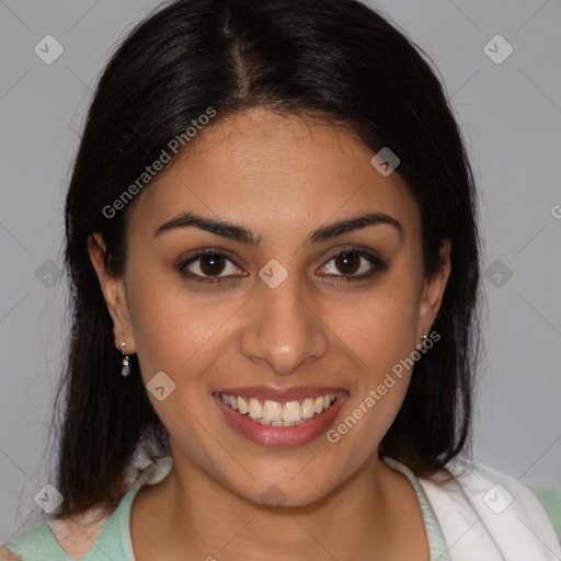 Joyful latino young-adult female with medium  brown hair and brown eyes