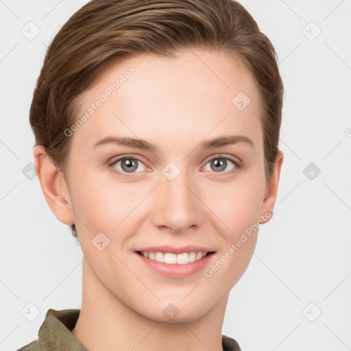 Joyful white young-adult female with short  brown hair and grey eyes