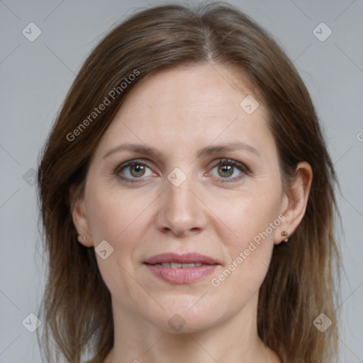 Joyful white adult female with medium  brown hair and grey eyes