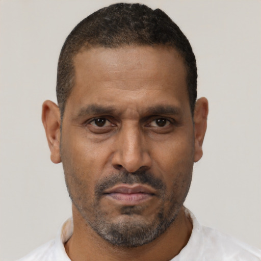 Neutral latino adult male with short  brown hair and brown eyes