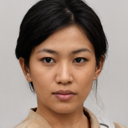 Neutral asian young-adult female with medium  black hair and brown eyes