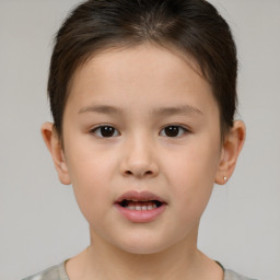 Joyful white child female with short  brown hair and brown eyes