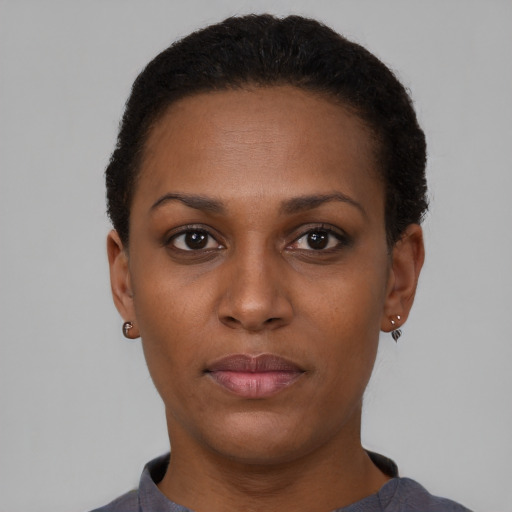Neutral black young-adult female with short  brown hair and brown eyes
