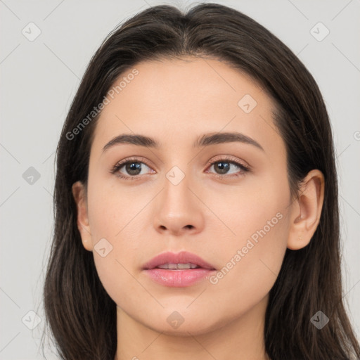 Neutral white young-adult female with long  brown hair and brown eyes