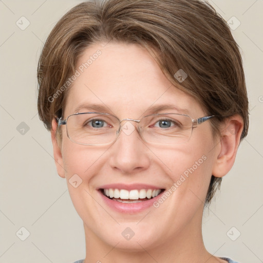 Joyful white adult female with short  brown hair and grey eyes