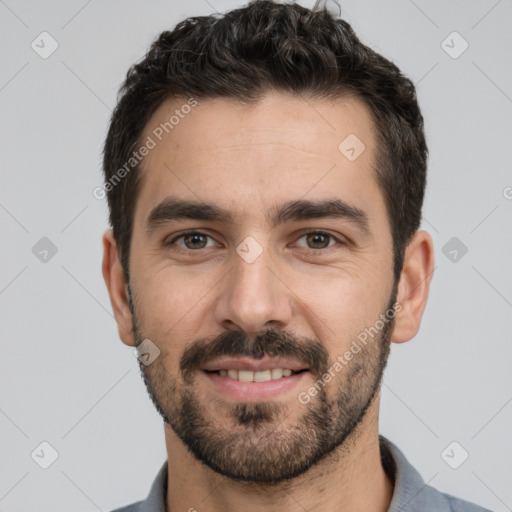 Joyful white young-adult male with short  black hair and brown eyes