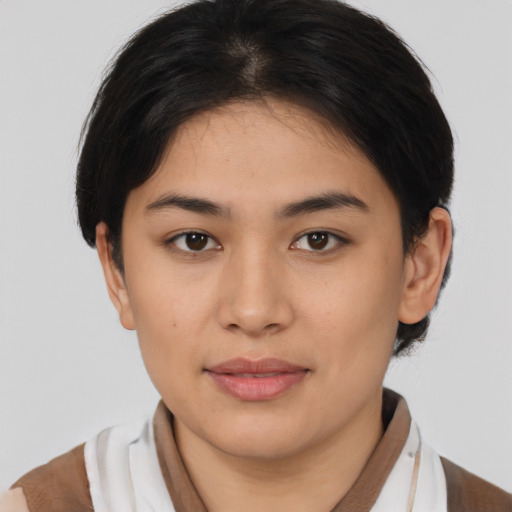 Joyful latino young-adult female with medium  brown hair and brown eyes