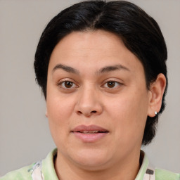 Joyful white adult female with medium  brown hair and brown eyes